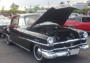 front of black 1951 windsor with hood open